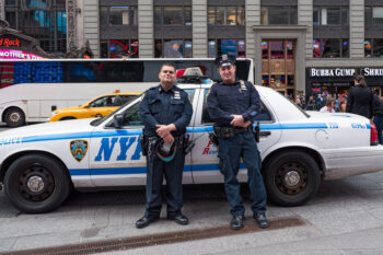 NEW YORK CITY - MAY 2015: NYPD Police Officers at Times Square. The New York City Police Department, established in 1845, is the largest municipal police force in the United States.