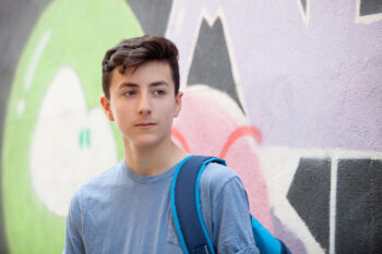 Rebel student with a background wall graffiti losing classes